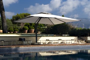 Large cantilever parasol over the pool