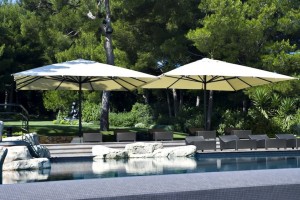 Two Magnum commercial umbrellas overlooking the pool