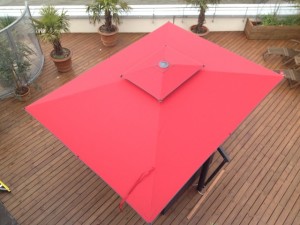 Garden parasol with bright red canopy