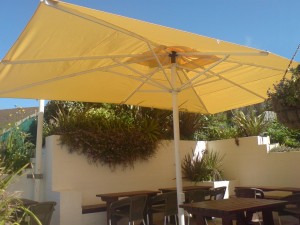 Clean umbrella against blue sky background